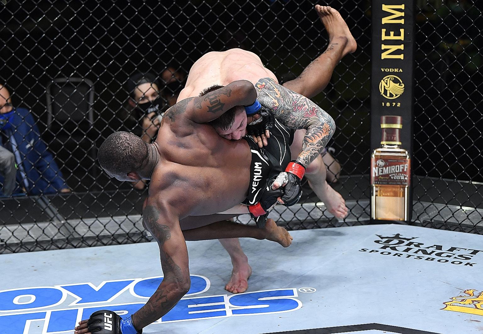 Italian mixed martial arts fighter Marvin Vettori on the way to beating Kevin Holland of the United States and setting a middleweight record with 11 takedowns during the UFC Fight Night event in Las Vegas, Nevada.