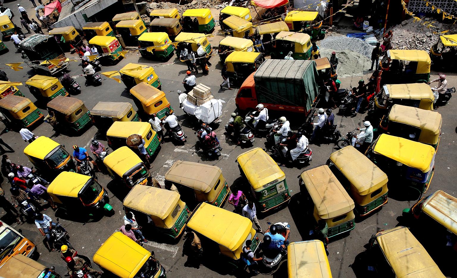 Heavy traffic yesterday in the city market area in Bangalore. India reported a new daily record of over 168,000 cases yesterday to take its total to 13.5 million cases, above Brazil's 13.48 million. Huge religious festivals and political rallies in p