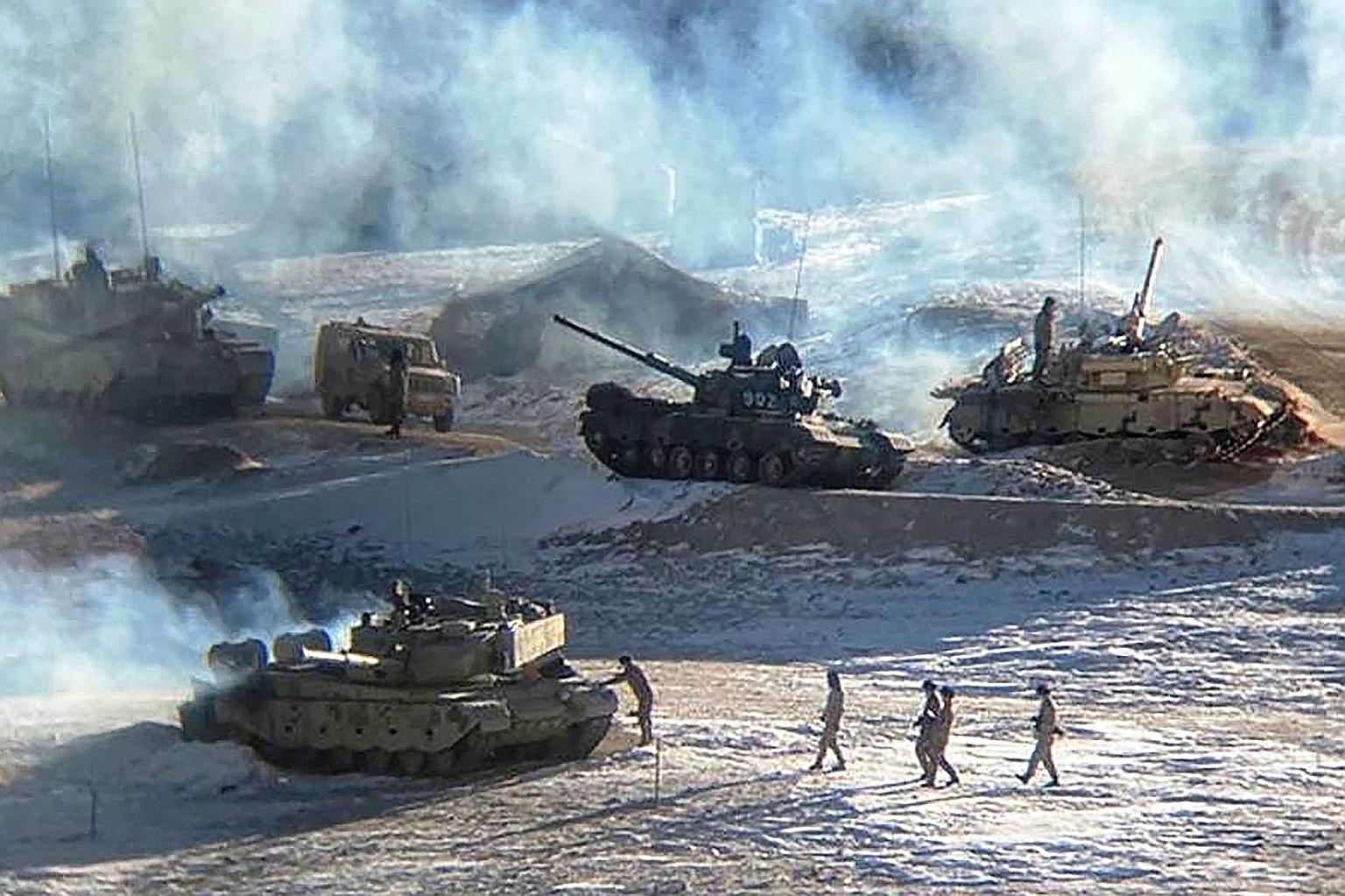A Feb 16 photo from the Indian Army showing Chinese troops and tanks during their disengagement from the India-China border in Ladakh. PHOTO: AGENCE FRANCE-PRESSE