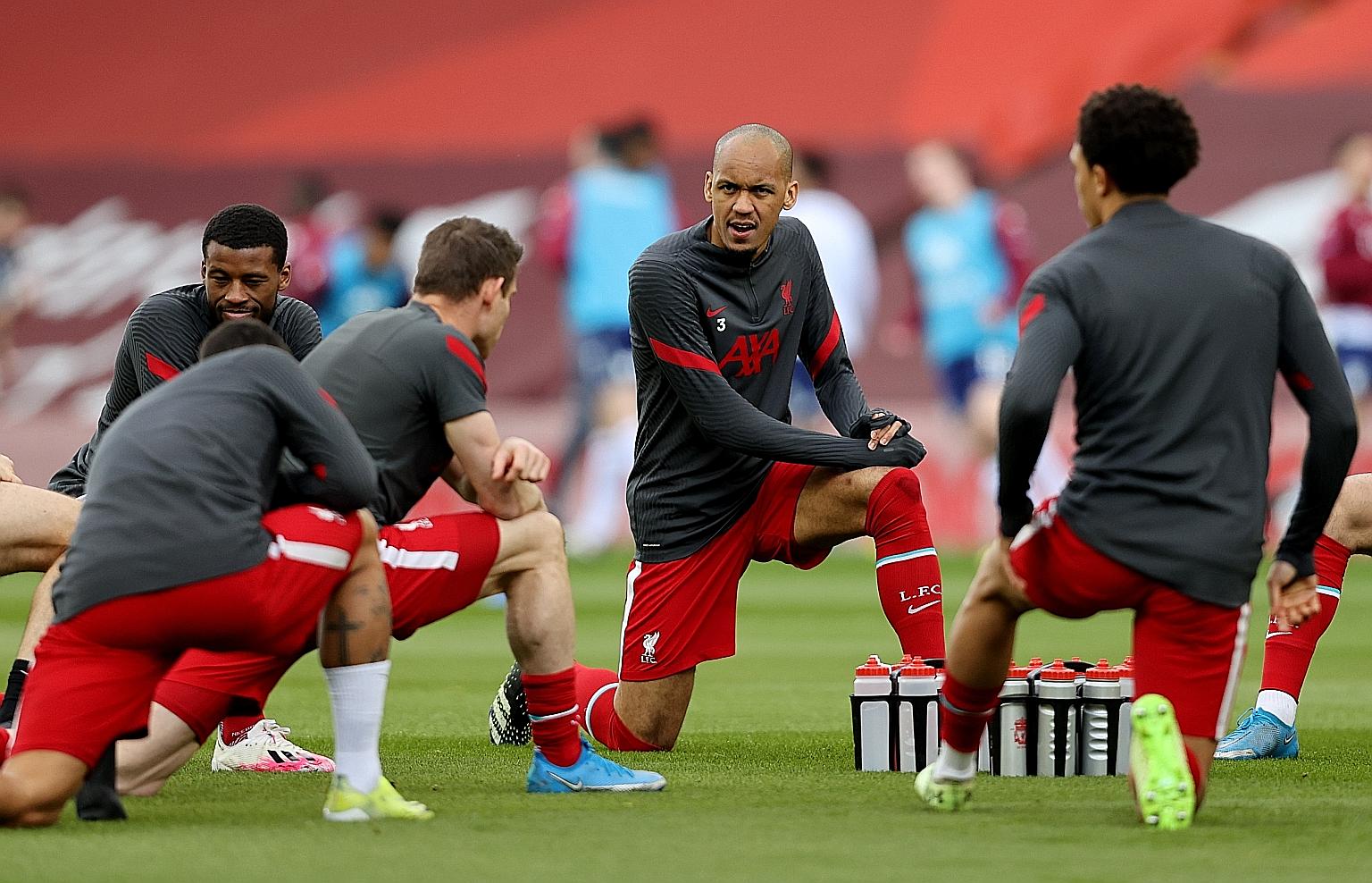 Liverpool's Fabinho (centre) is set to play alongside Thiago Alcantara today to stop Real's Toni Kroos, Casemiro and Luka Modric from bossing the midfield again.