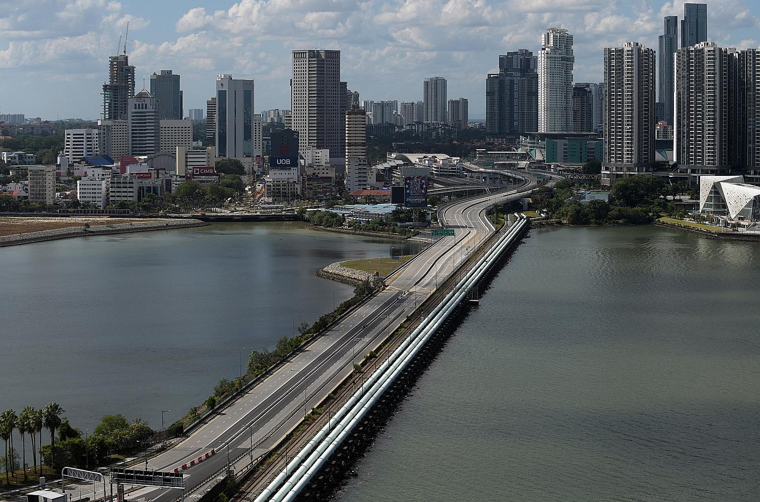 A view of Johor Baru from Woodlands. The Malaysian Foreign Minister said that although the Johor government is keen to reopen the border within the next two months, Malaysia must get Singapore's approval first. ST PHOTO: ALPHONSUS CHERN