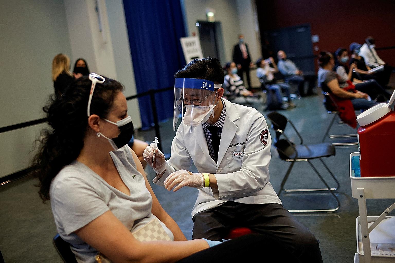 A woman receiving the Johnson & Johnson Covid-19 vaccine in Chicago, Illinois, last week. The White House said the pause in its use will not have a significant impact on its plan to administer about three million shots daily.