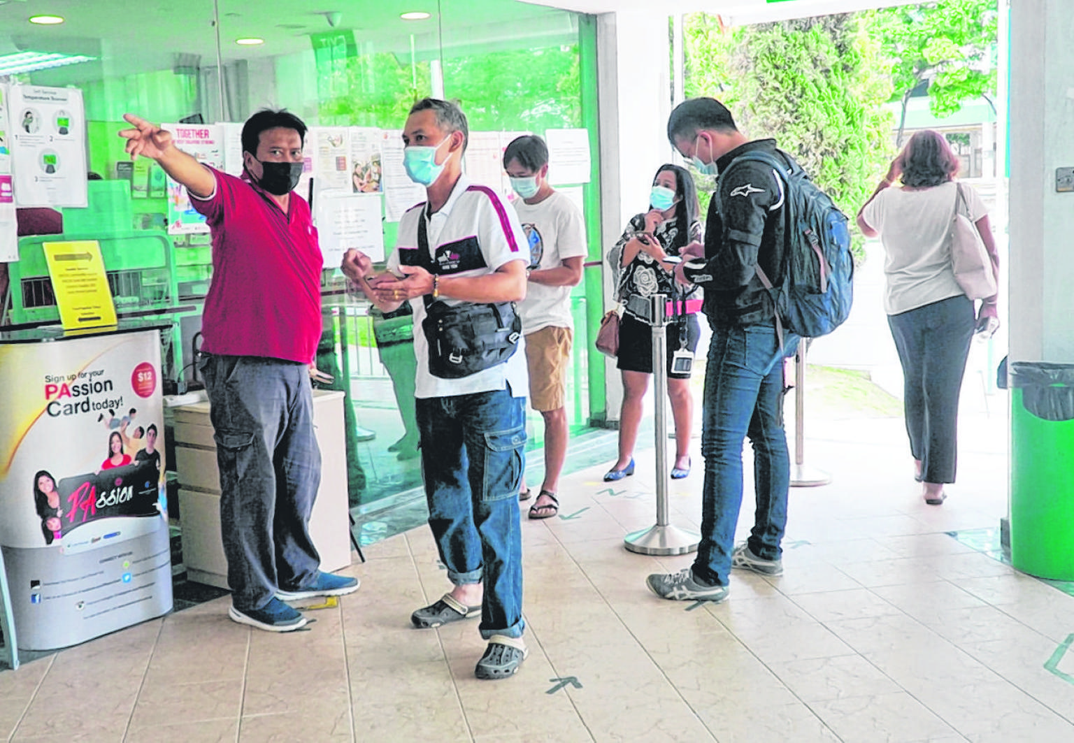 People at Marsiling Community Club yesterday to get their Covid-19 shots. Residents can choose which vaccination centre or polyclinic they wish to go to for their jabs, although certain centres may have limited slots. ST PHOTO: MOHD KHALID BABA