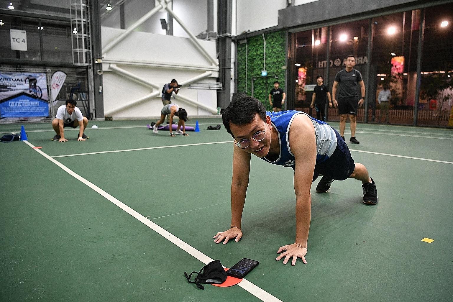 Straits Times reporter Lim Min Zhang during an NS FIT session at Our Tampines Hub on April 5. He said that even though he took more breaks than was prescribed, the one-hour workout left him with muscle aches that lasted for days.