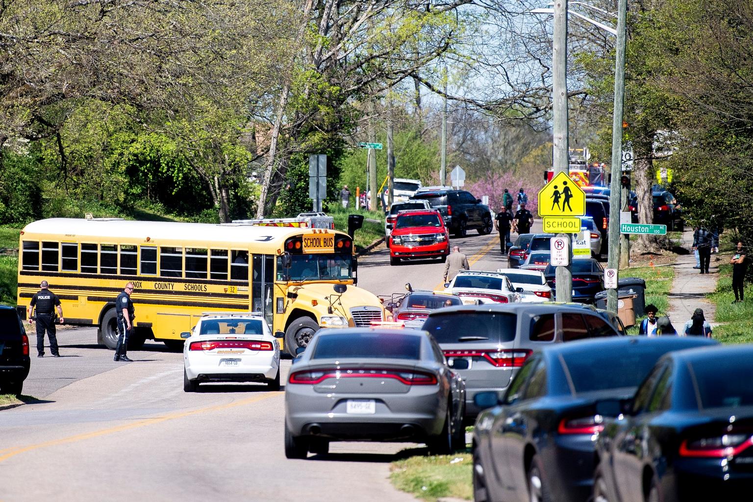 Police officers at Austin-East Magnet High School in Knoxville, Tennessee, on Monday. A student suspect opened fire on the police in a school bathroom, wounding an officer who needed surgery. PHOTO: REUTERS