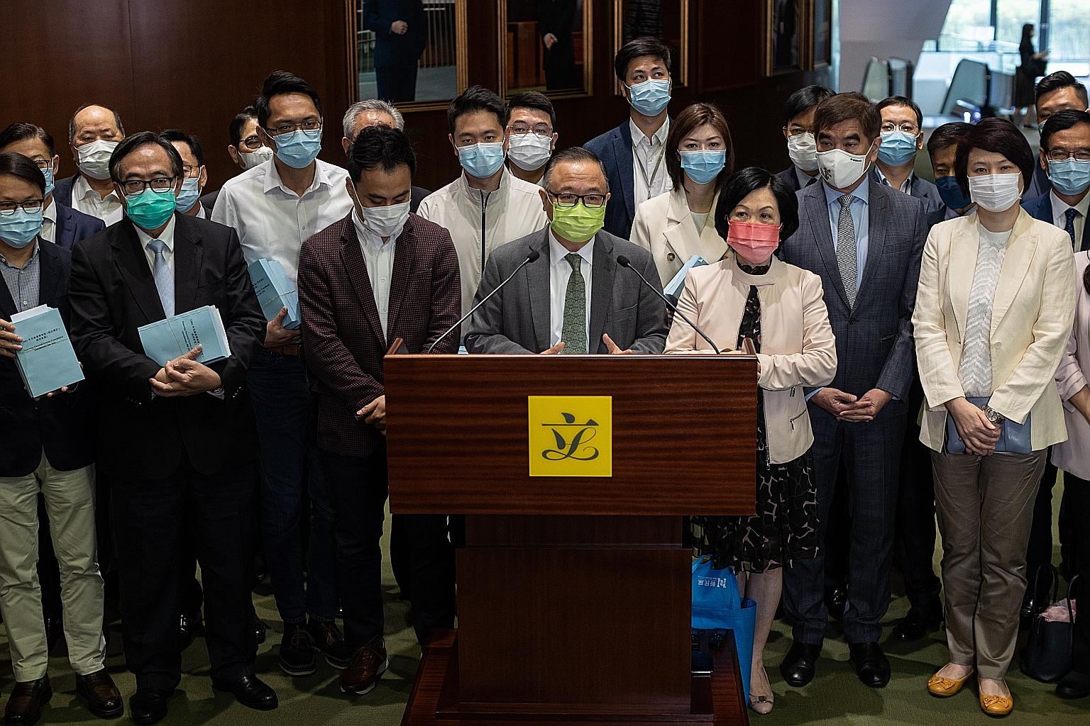 Pro-establishment lawmakers talking to reporters at Hong Kong's Legislative Council (LegCo) yesterday. The LegCo election will be on Dec 19.