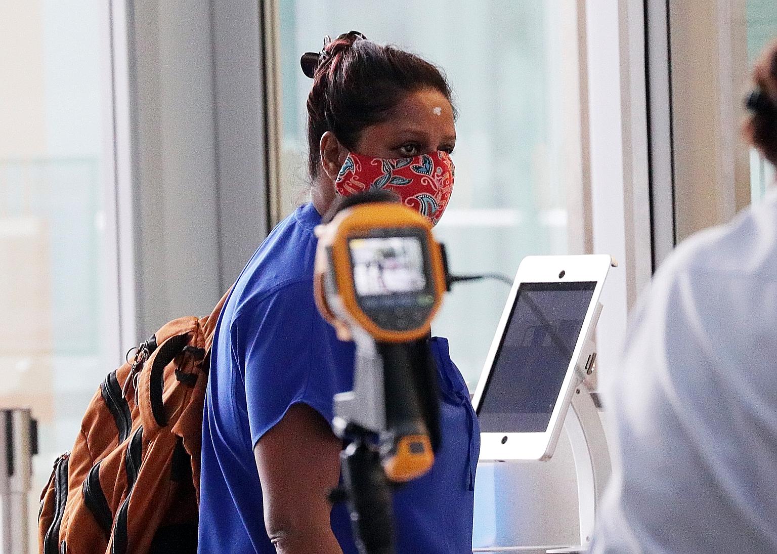 Gayathri Iyer entering the State Courts yesterday. She had been convicted in February of abusing her Myanmar maid, after slapping her so hard that she suffered a temporary loss of hearing.