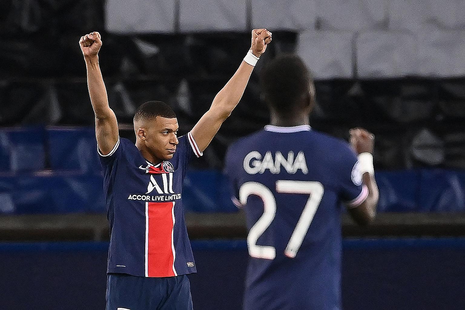 Kylian Mbappe and teammate Idrissa Gueye celebrating at the end of a nervy Champions League quarter-final, second-leg match against Bayern Munich on Tuesday. The 1-0 loss, for a 3-3 aggregate, was enough for Paris Saint-Germain to qualify on away goa