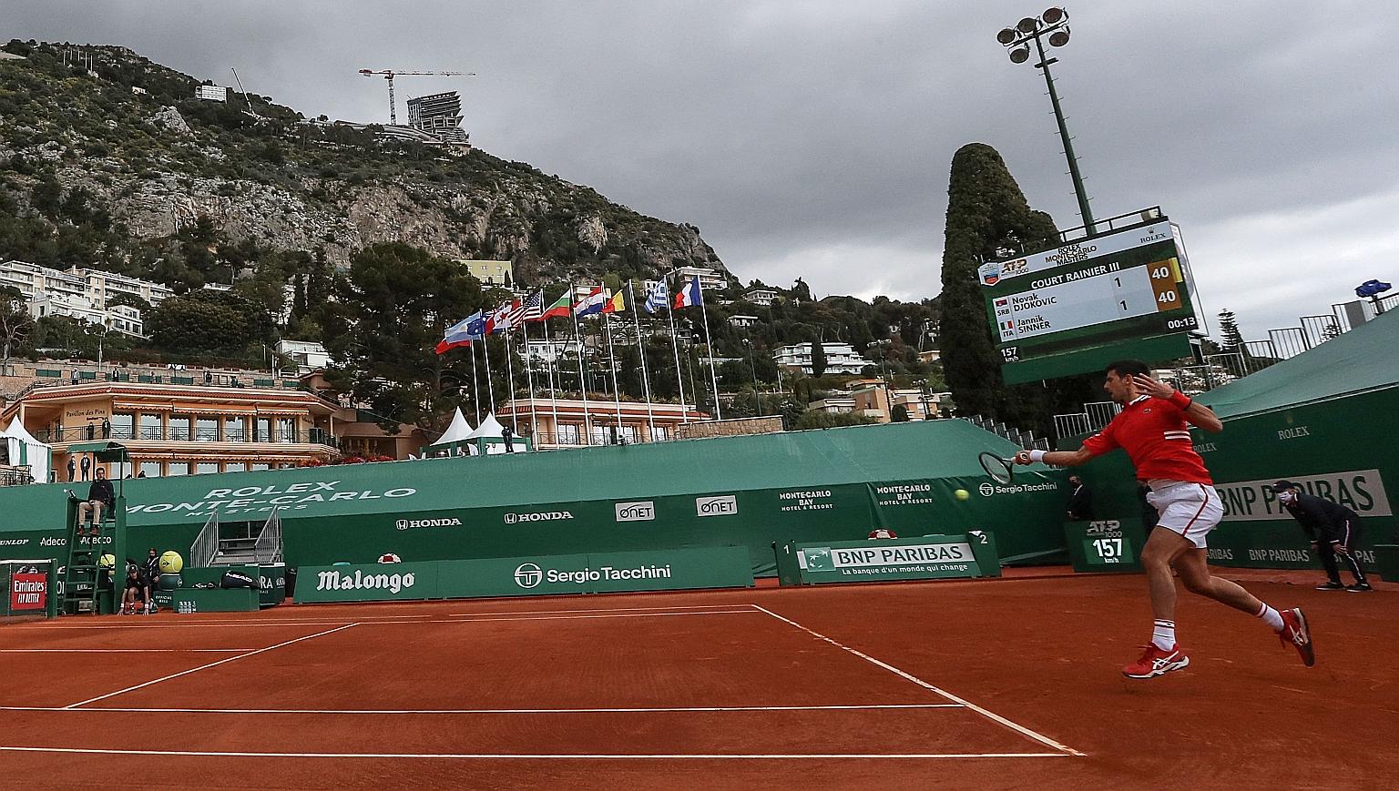 Novak Djokovic playing a return to Italy's Jannik Sinner during their Monte Carlo Masters last-32 clash yesterday. The Serb won 6-4, 6-2 in his first match back on Tour since his Australian Open win in February.