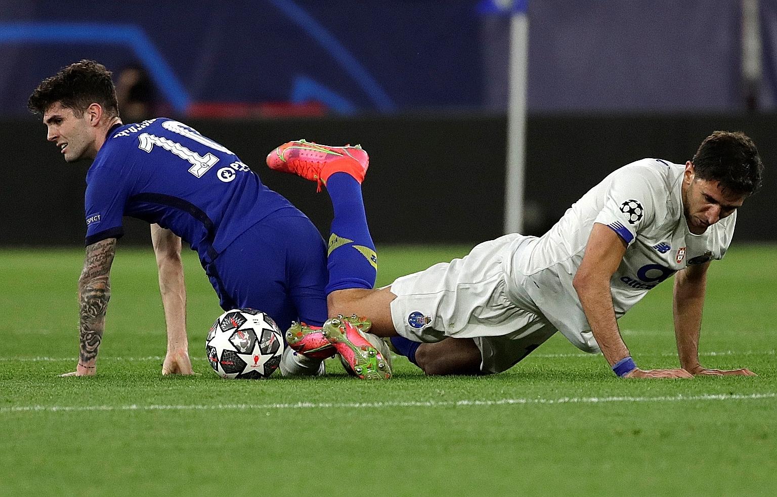 Chelsea winger Christian Pulisic (far left) fighting for the ball with Porto's Marko Grujic during their Champions League quarter-final, second-leg match in Seville. The Blues are through to the semi-finals 2-1 on aggregate.