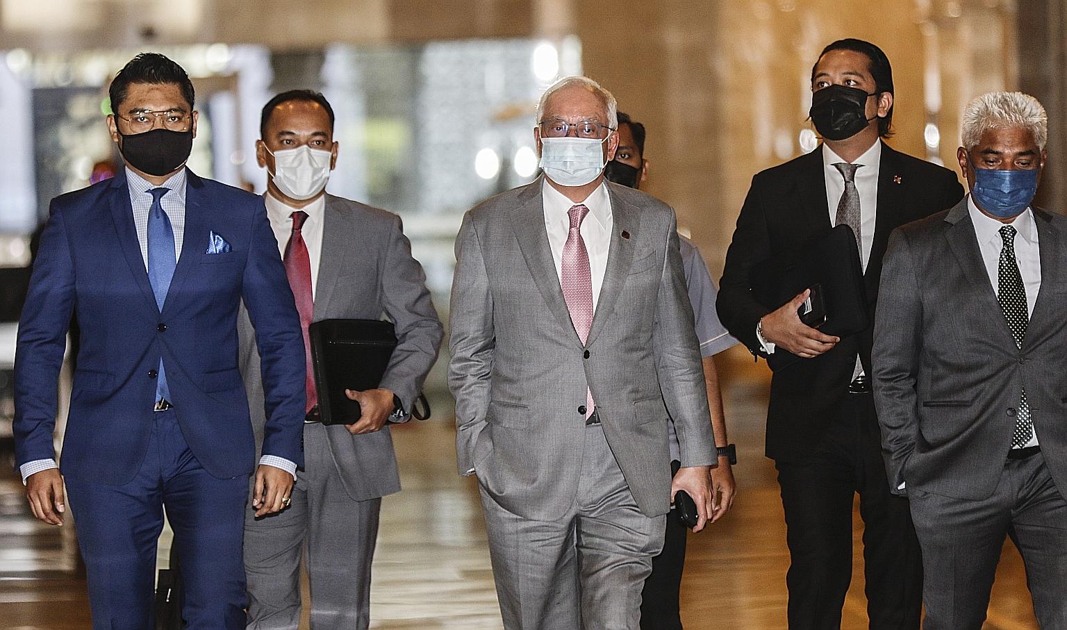 Najib Razak (centre) arriving at the Court of Appeal in Putrajaya yesterday. The Pekan MP remains free, pending his appeal. PHOTO: EPA-EFE