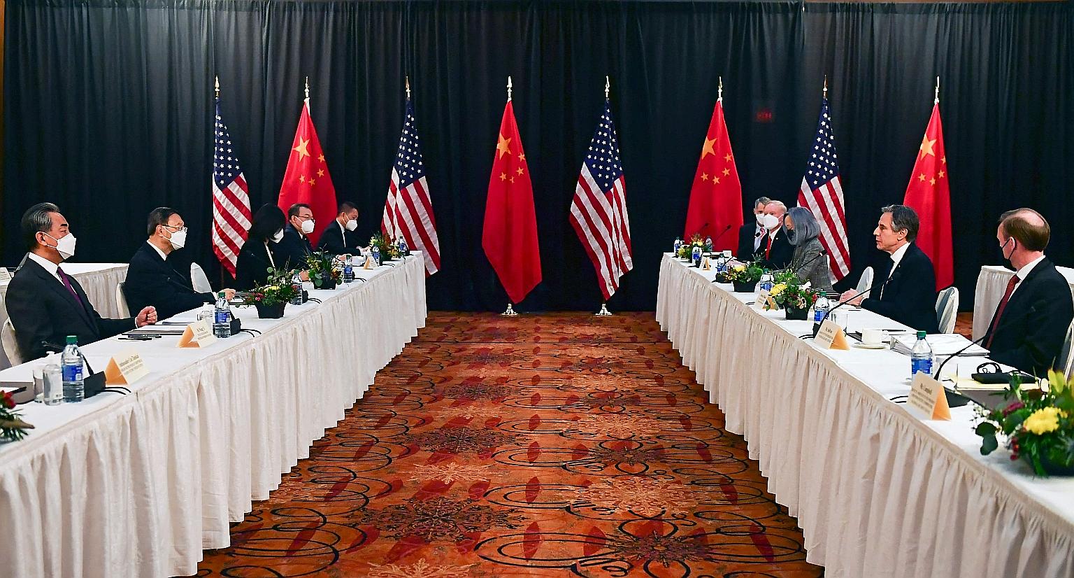 Chinese and American officials at the opening session of Sino-US talks in Alaska last month. A major US intelligence report published on Tuesday suggests that so-called grey-zone battles for power - which are meant to fall short of inciting all-out w