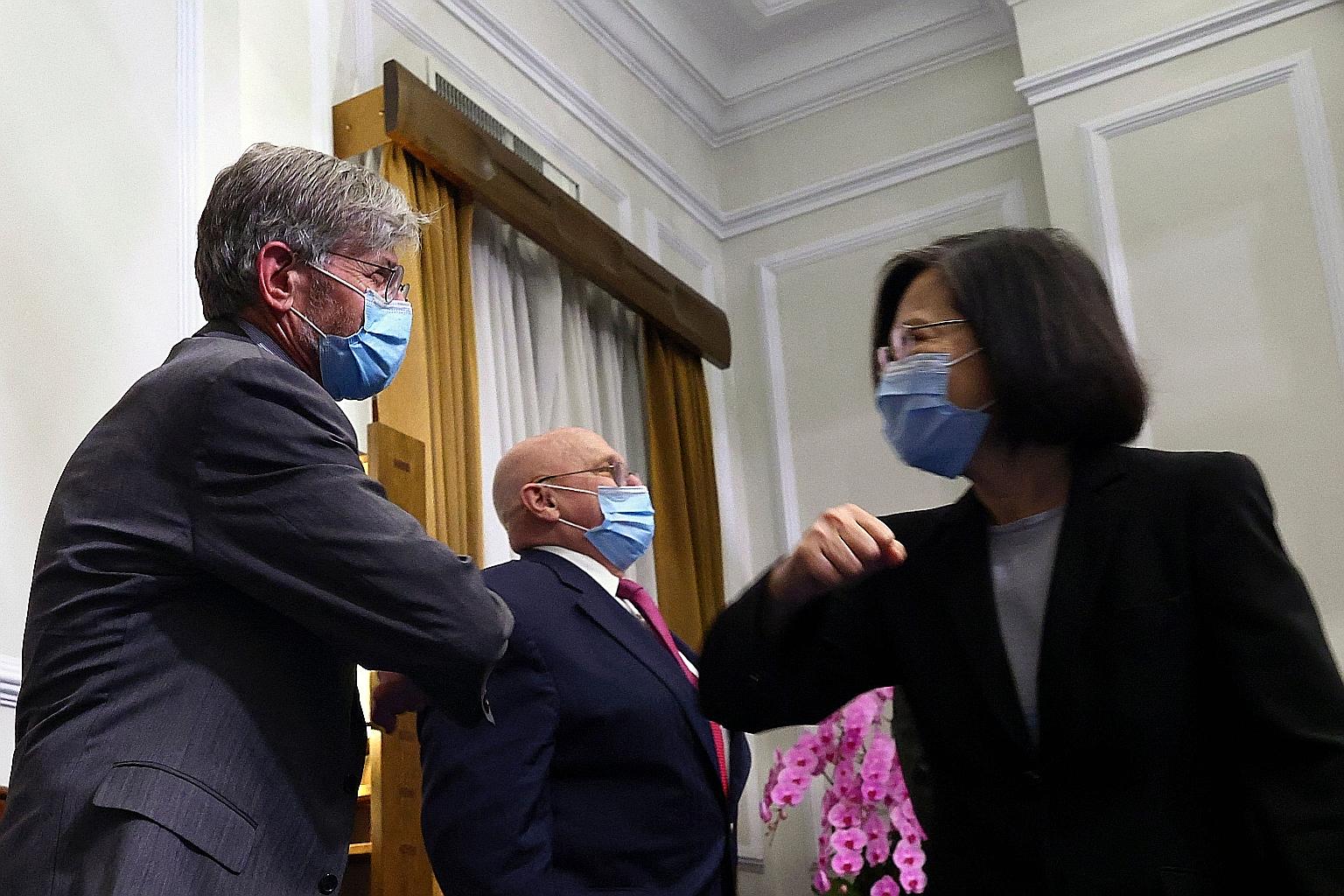 Taiwan President Tsai Ing-wen greeting former US deputy secretary of state James Steinberg, with fellow envoy Richard Armitage (centre), in a meeting at the Presidential Office in Taipei yesterday. PHOTO: EPA-EFE