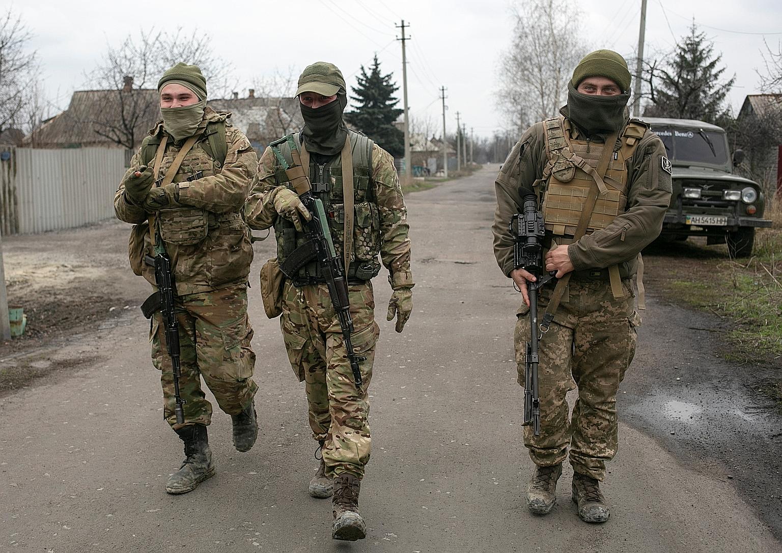 Ukrainian soldiers in the country's Donetsk region on Wednesday. If Russian sources are to be believed, Ukraine may be planning to either retake the Crimea peninsula, a Ukrainian territory Russia invaded and annexed in 2014, or overrun the two enclav