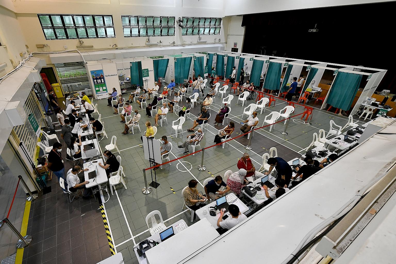People getting their vaccination at the Hong Kah North Community Club last month. The Ministry of Health said Covid-19 vaccines that are used in Singapore have been assessed to be safe and efficacious by both the Health Sciences Authority and the Exp