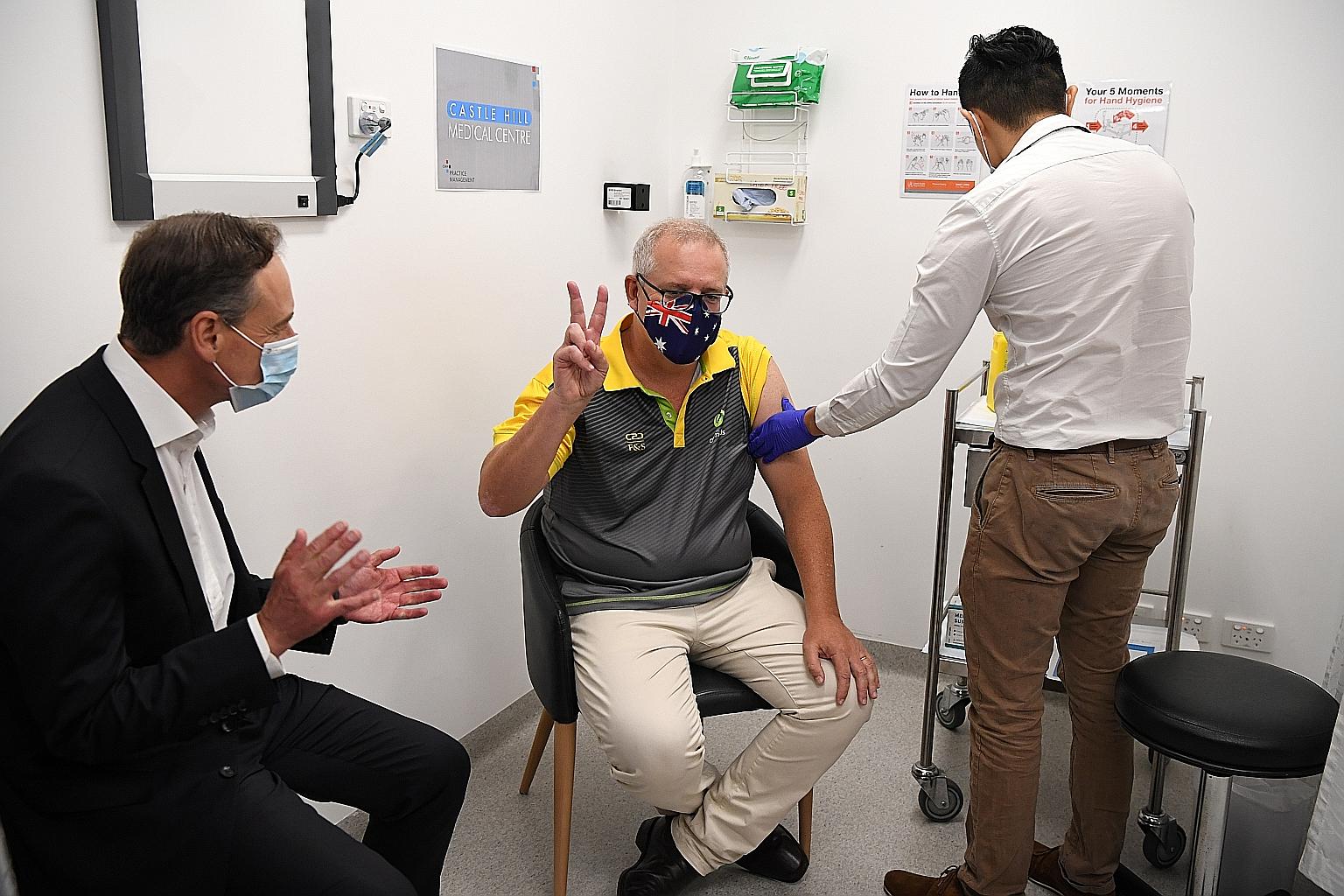 Australian Prime Minister Scott Morrison making the V sign after receiving his Covid-19 jab in Sydney in February. However, his country's vaccine roll-out has been beset by broken promises, backdowns and missed deadlines.