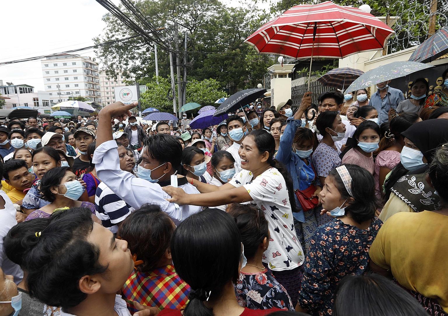Relatives and friends milling outside a jail in Yangon yesterday for reunions with freed prisoners. While the junta has released 23,184 inmates from prisons across the country under a New Year amnesty, few if any democracy activists arrested since th