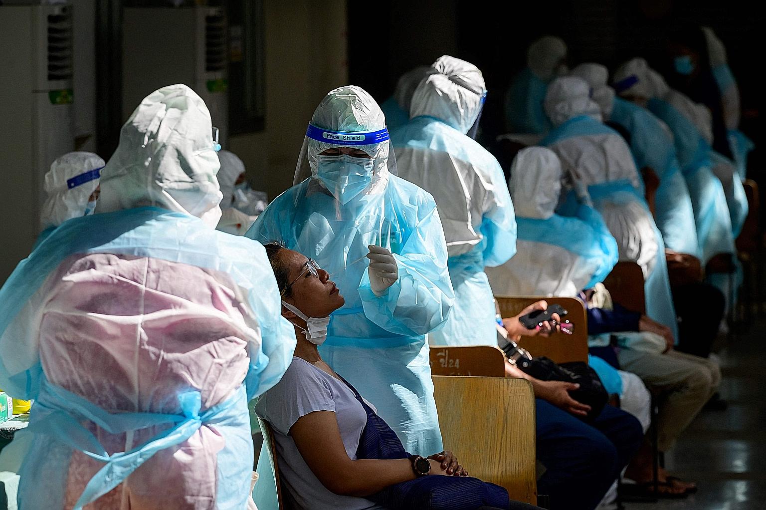 A Covid-19 test site in Bangkok yesterday. In the past 10 days, Thailand's infection tally has jumped from 29,900 to over 40,500.
