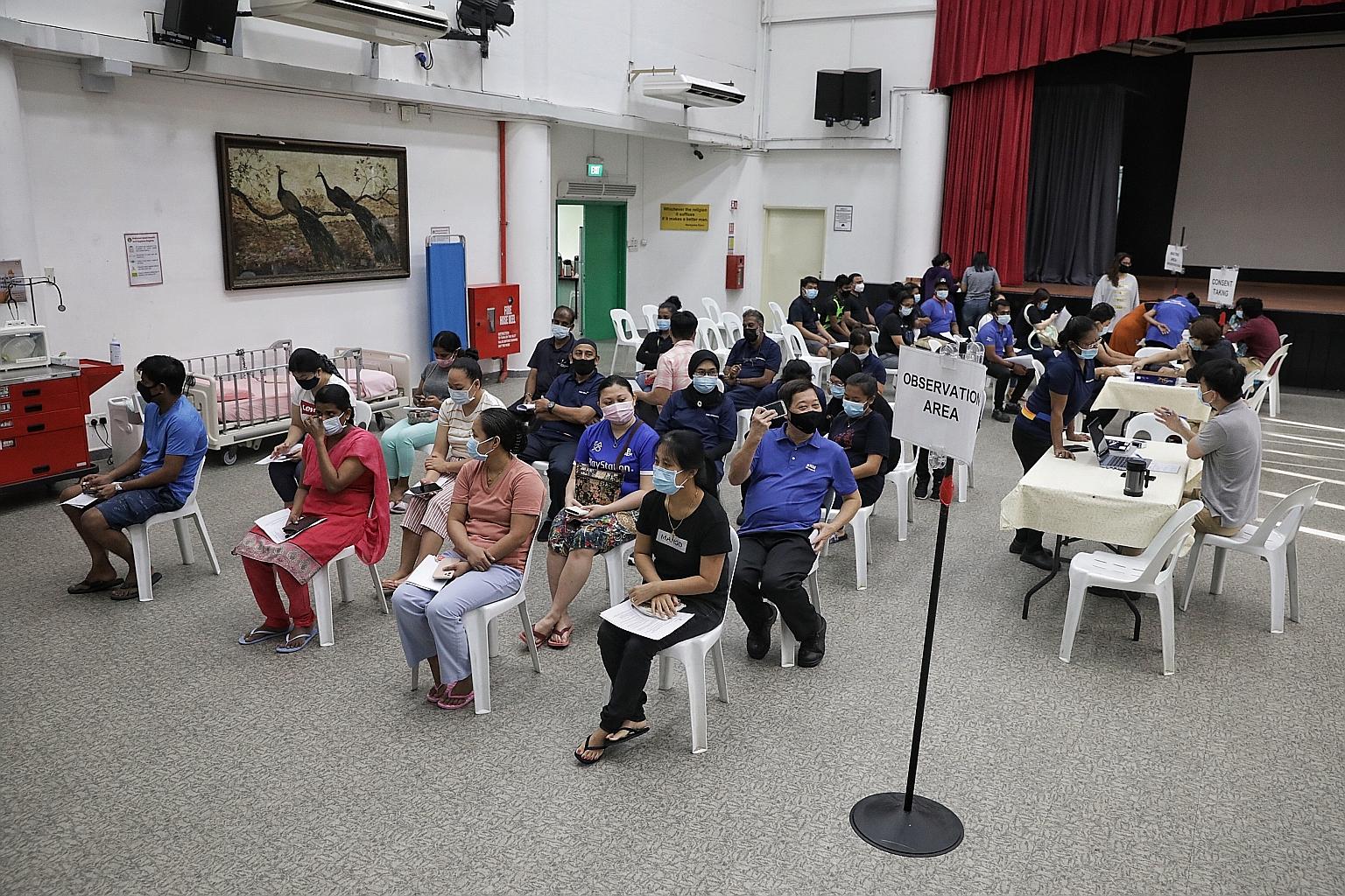 Staff of Sree Narayana Mission at the observation area after receiving their Pfizer jabs in January. Results of clinical trials for both the Pfizer and Moderna vaccines show that younger adults tend to report more frequent and severe side effects tha