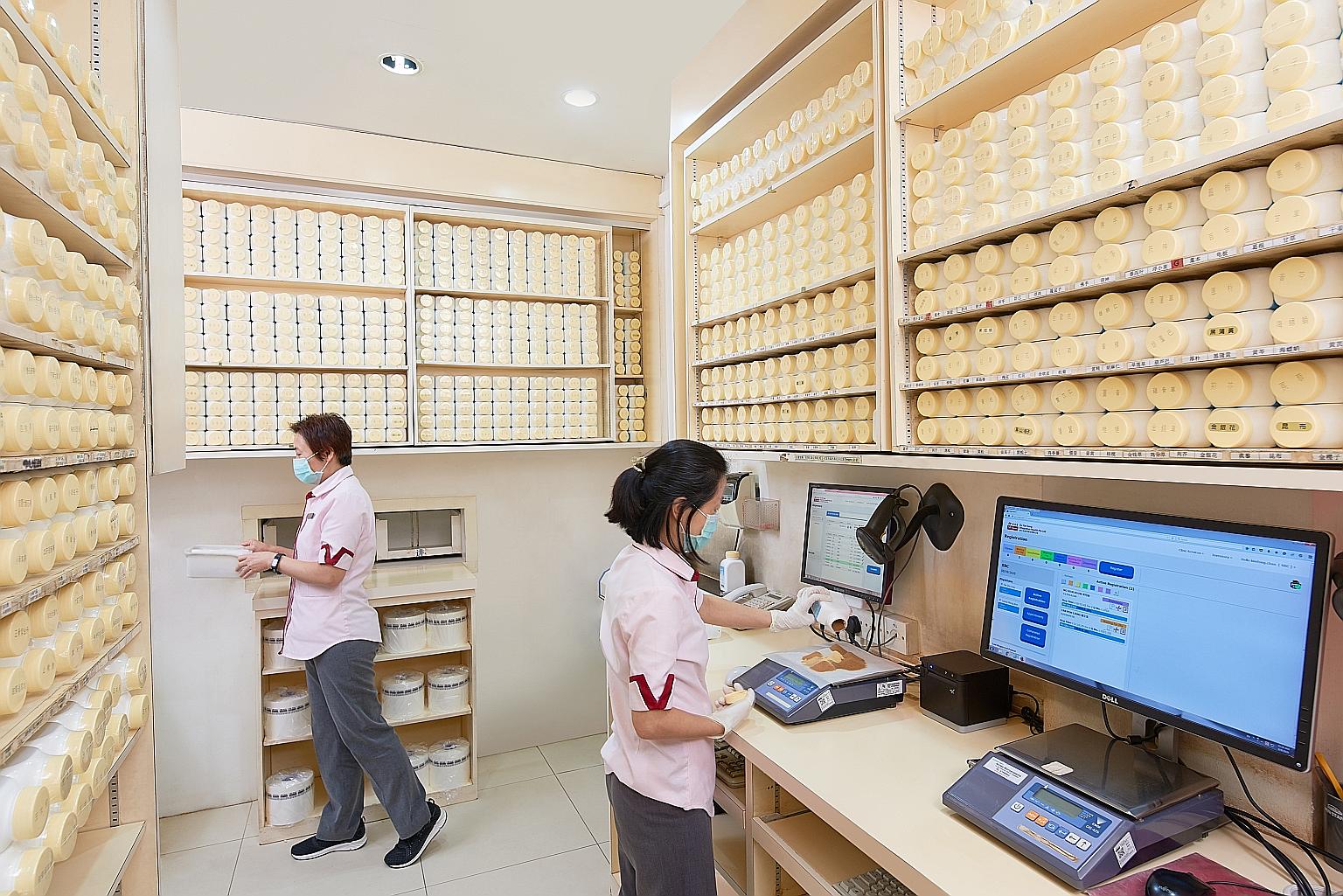 A herb dispensary at Eu Yan Sang's traditional Chinese medicine clinic. The healthcare firm has pivoted from physical shopping to contactless purchase and delivery. Customers can now place orders via an online store, social media channels or even Wha