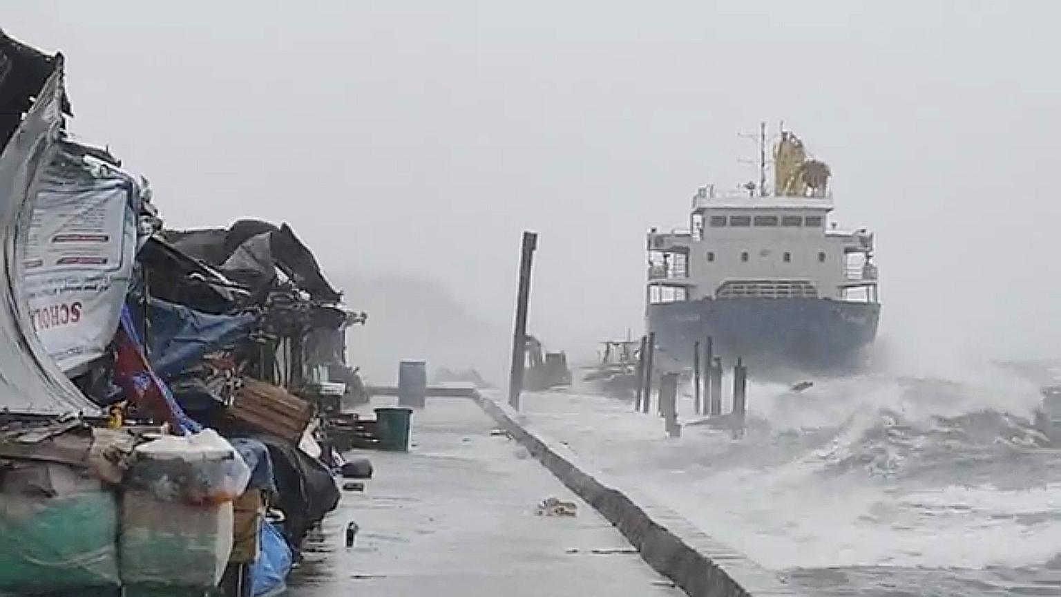 Waves crashing against the shore in the Philippines' Catbalogan city yesterday. Super Typhoon Surigae is not expected to hit land, but will bring heavy rain and strong winds to eastern provinces. PHOTO: REUTERS