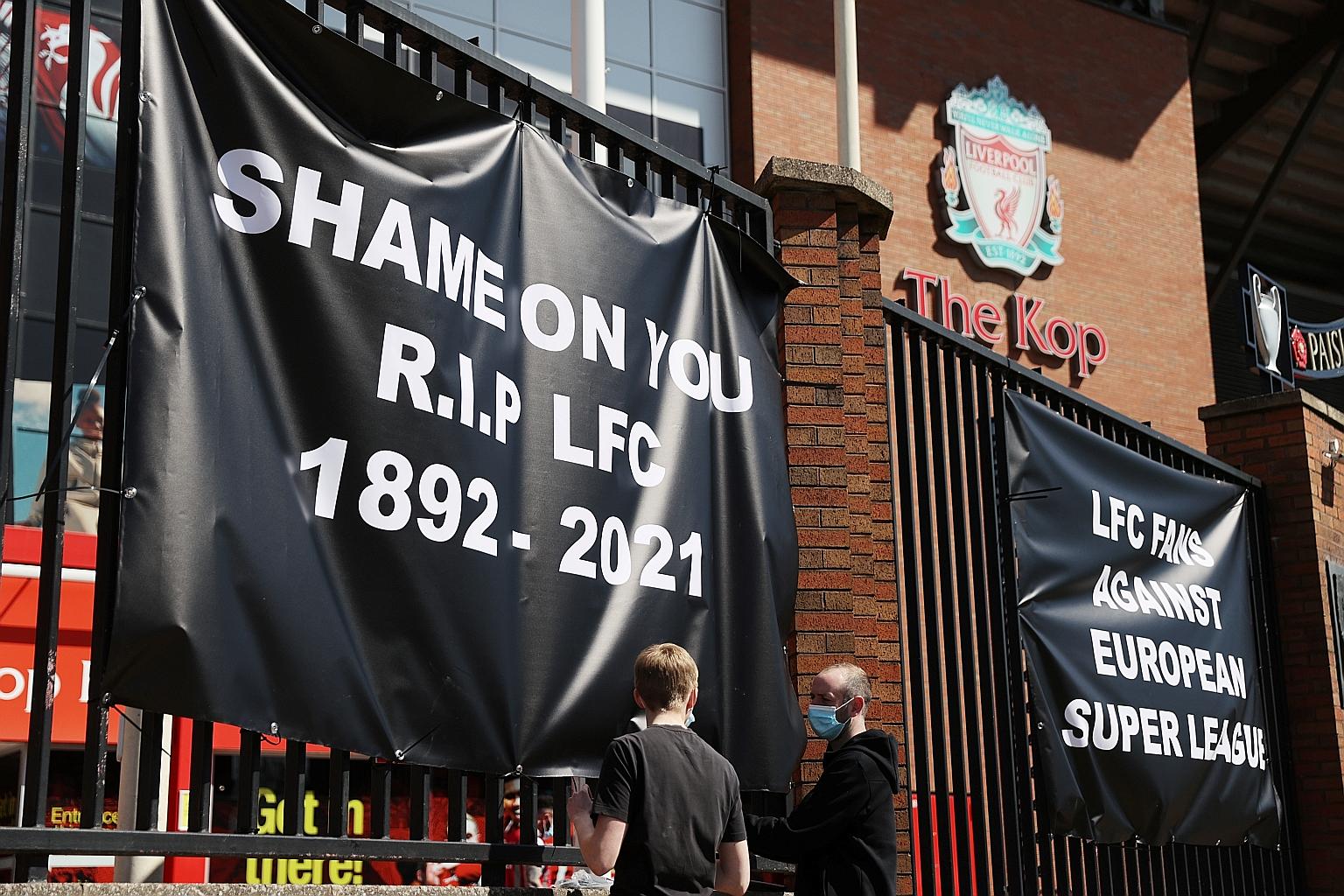 Anti-Super League banners and Liverpool fans outside Anfield yesterday. Liverpool won the Champions League in 2019 for the first time in 14 years.