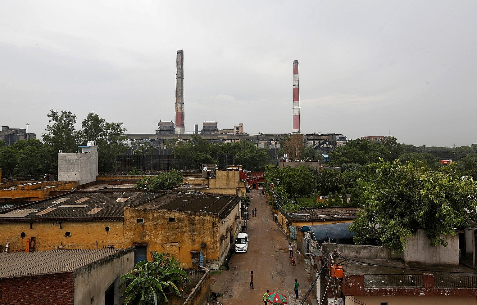 Chimneys of a coal-fired power plant seen in New Delhi. Coal still accounts for nearly three-fourths of India's annual power output.