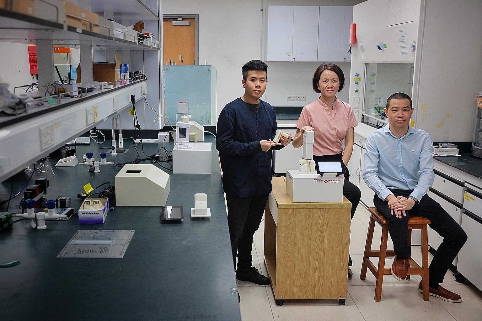 Below, from left: Silver Factory co-founders Phang-Quang Gia Chuong, Ling Xing Yi and Phang In Yee with the company's Covid-19 breathalyser. Silver Factory's breathalyser, TracieX, has been shown to be almost as accurate as polymerase chain reaction