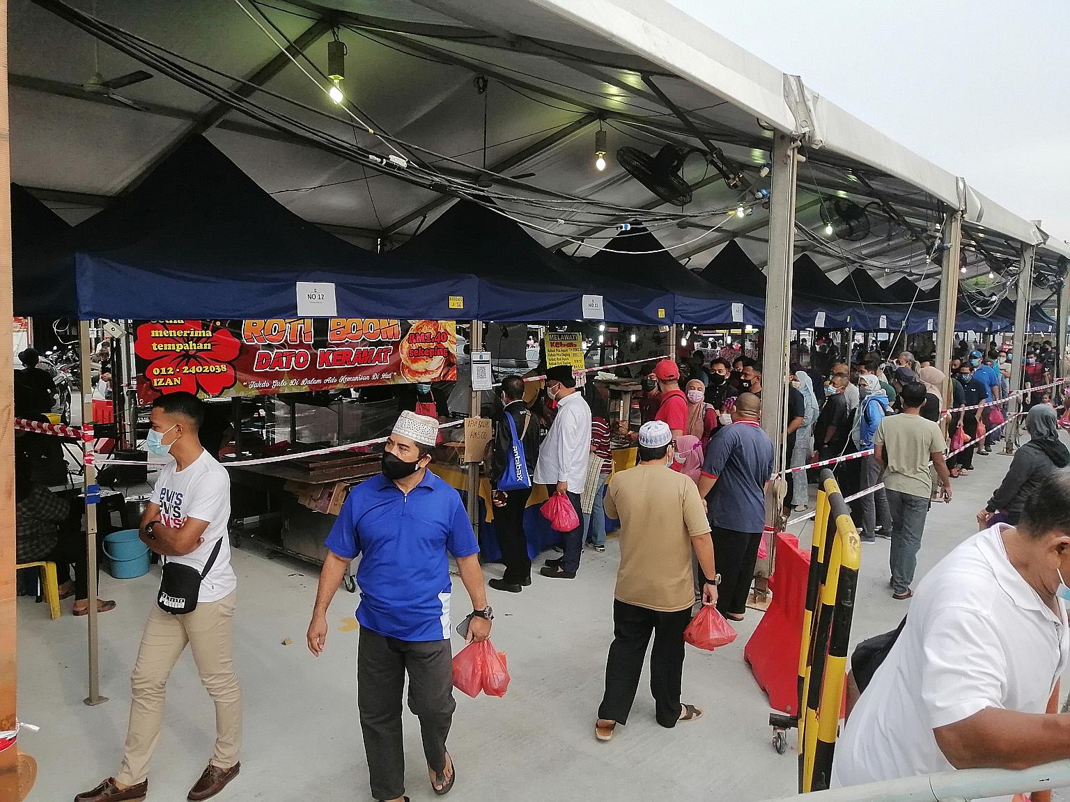 Visitors not observing safe distancing at a Ramadan bazaar in Kuala Lumpur last Friday. Malaysians have been angry over what they see as double standards in the government's response to Covid-19, with members of the public heavily fined and even jail
