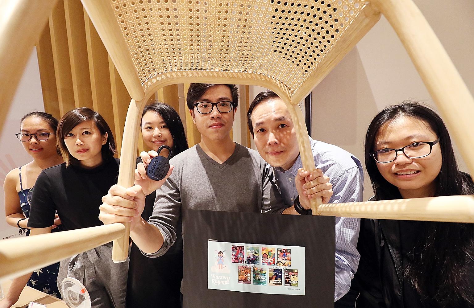 Singapore Creator Awards 2019 winners (from left) Emily Chan, Jessica Wong, Tan Kaihui, David Jonathan Ui, Andy Koh Boon Peng and Chan Xiao Lin with a nursery rhyme-themed stamp collection, a smart padlock and a lightweight rattan stool, which were a