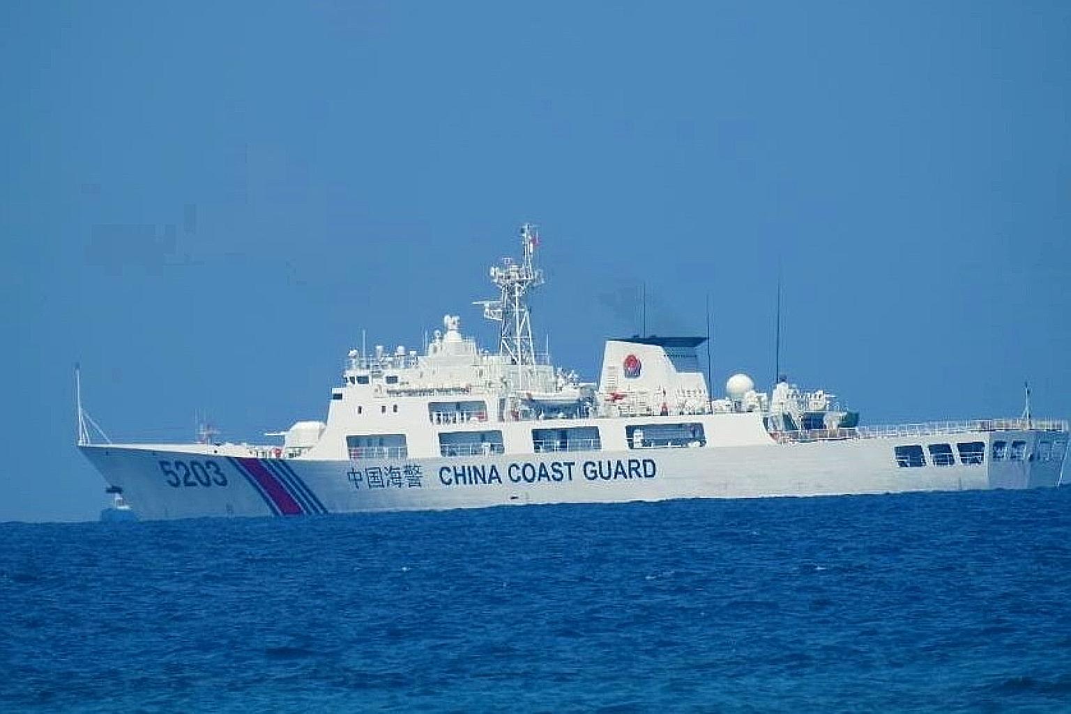A China Coast Guard patrol ship seen in the South China Sea last week, in a photo distributed by the Philippine Coast Guard. Beijing claims nearly all of the sea but there are competing claims from Brunei, Malaysia, the Philippines and Vietnam.
