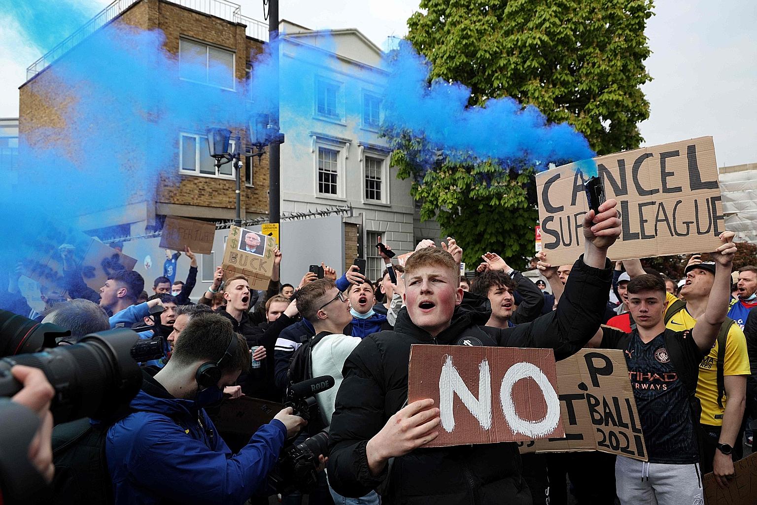 A large group of supporters demonstrating their displeasure with the European Super League (ESL) outside Chelsea's Stamford Bridge stadium before their Premier League match against Brighton on Tuesday. Chelsea yesterday joined the five other English 