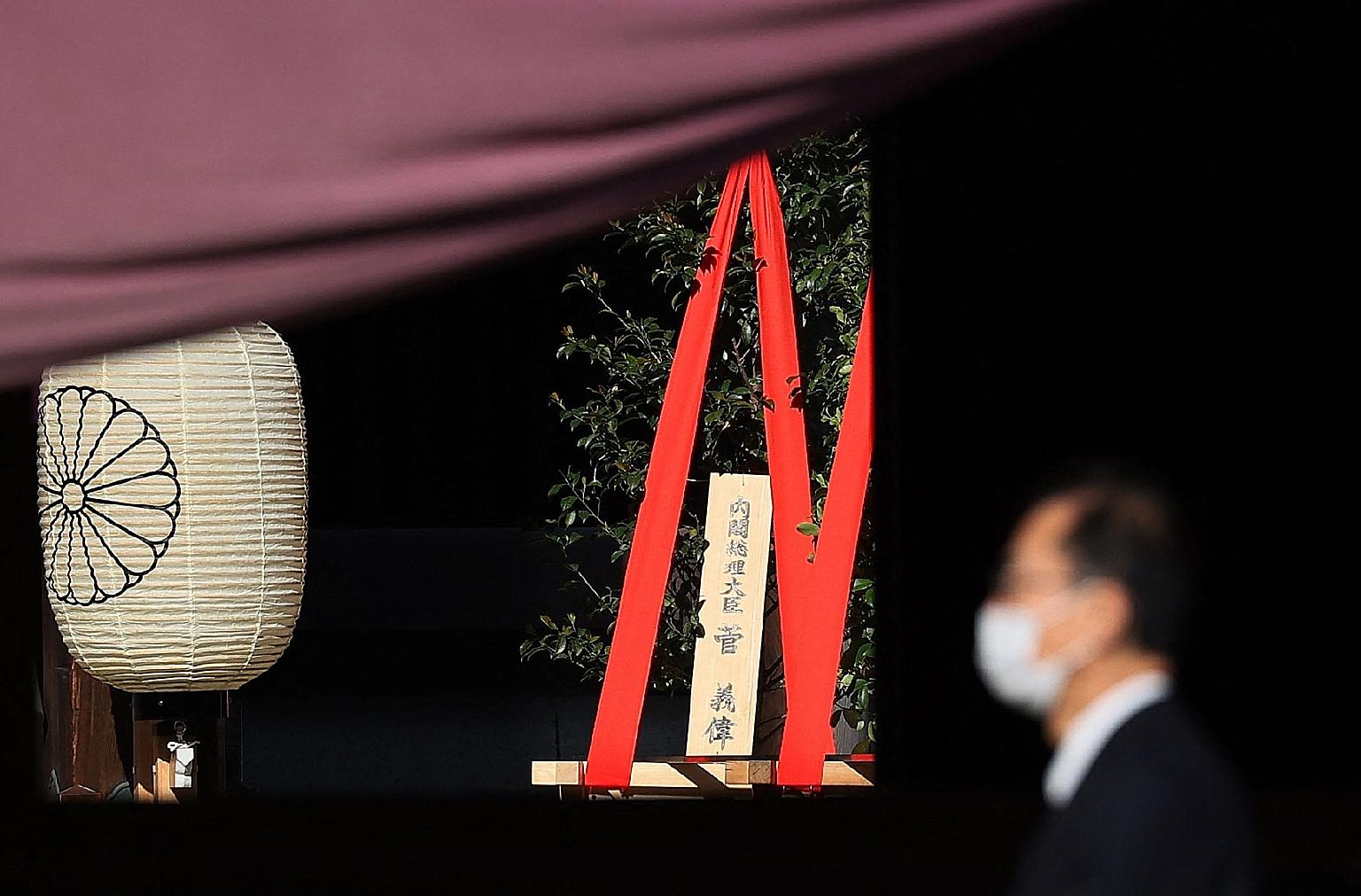 A ritual offering sent by Japanese Prime Minister Yoshihide Suga seen during the annual spring rites at Yasukuni shrine in Tokyo yesterday. The shrine honours some 2.5 million war dead, including senior military and political figures convicted of war