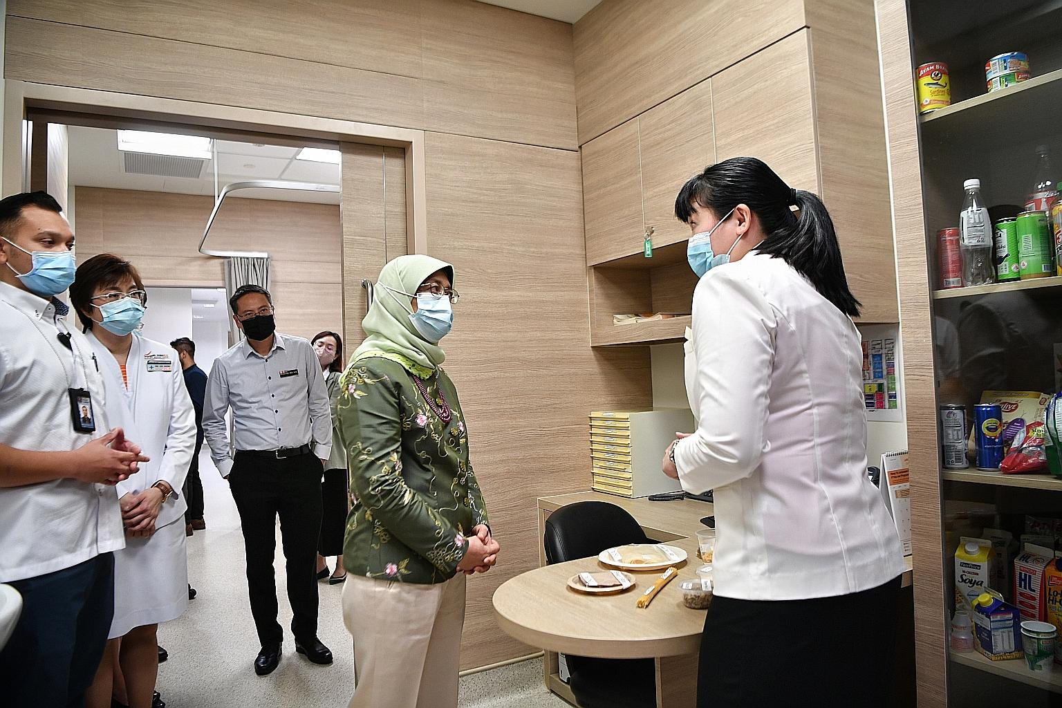 President Halimah Yacob touring the Diabetes, Obesity, Metabolism and Endocrine Centre at Changi General Hospital's Medical Centre yesterday. The centre allows patients to see multiple specialists such as endocrinologists, surgeons and dietitians dur