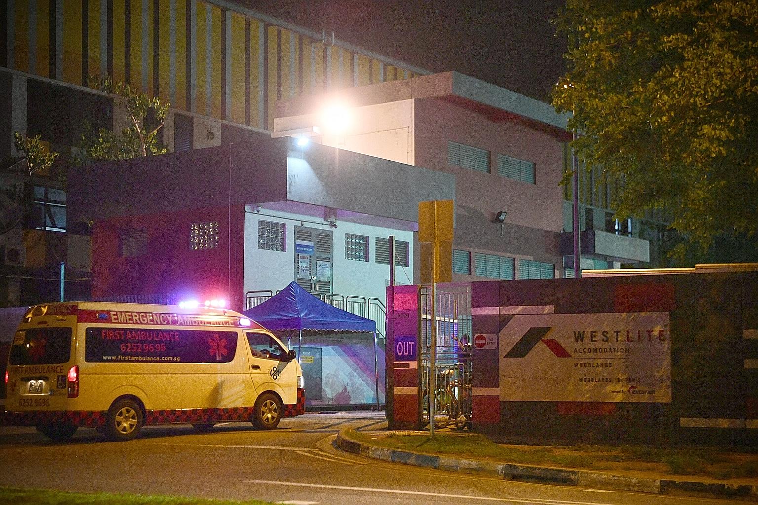 An ambulance entering the Westlite Woodlands dormitory last night. The Straits Times understands that plans are being made to move hundreds of workers to a quarantine facility. ST PHOTO: ARIFFIN JAMAR