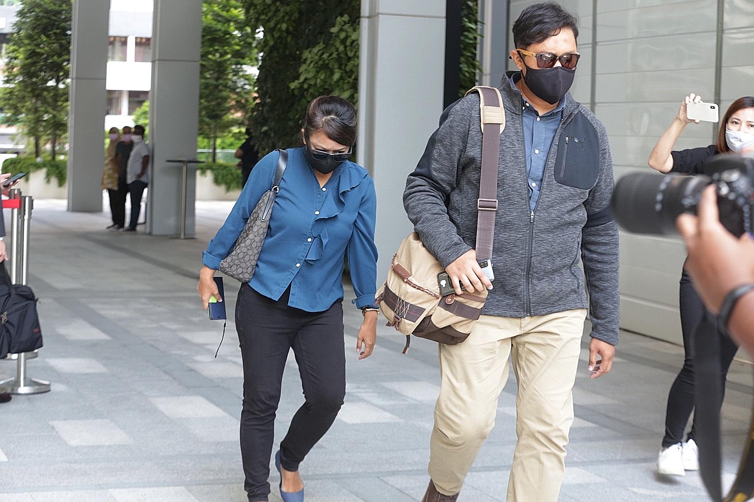 Noorain Jubli, who is personal assistant to the director-general of the Singapore Food Agency, and her husband Khairul Annuar Zakaria leaving the State Courts yesterday. They were charged under the Official Secrets Act. ST PHOTO: TIMOTHY DAVID