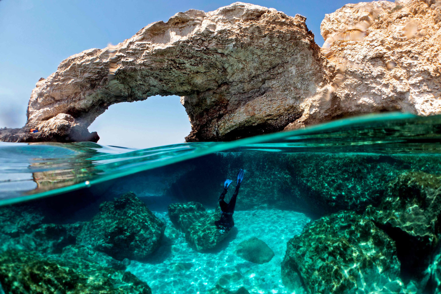 Cypriot marine ecologist Louis Hadjioannou, 38, photographing coral to monitor the impact of climate change on the delicate fauna in the crystal clear waters of Glyko Nero in Ayia Napa, off the island's south-eastern shore. A great global green trans