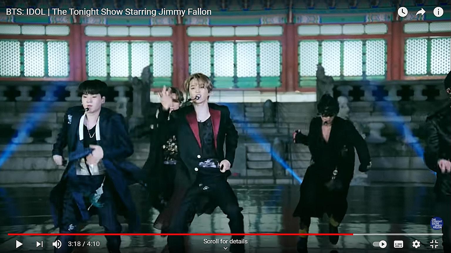 The outfit worn by Jimin (centre) is being auctioned off - unwashed.