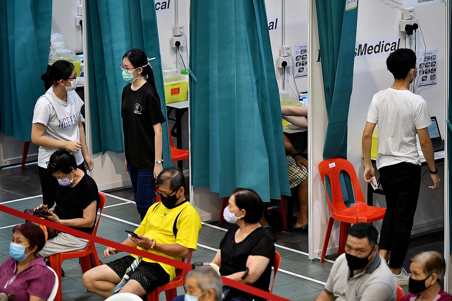 A Covid-19 vaccination site at Hong Kah North Community Club. One of the new local cases reported yesterday is a dormitory resident who had received both doses of the Covid-19 vaccine. ST PHOTO: LIM YAOHUI