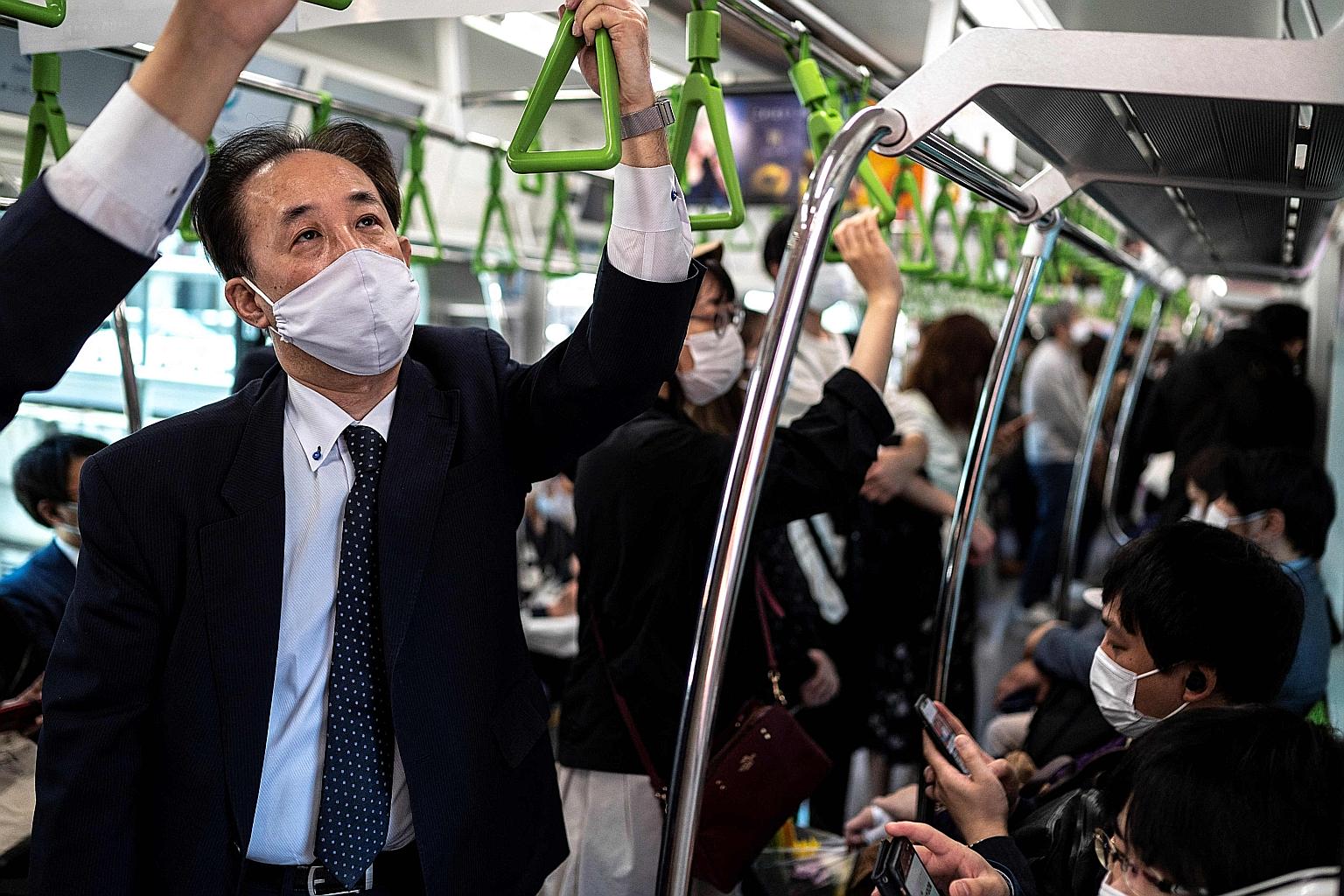 Public transport operators in Japan have said they will reduce the number of train services as the country heads into another state of emergency to curb Covid-19 cases. PHOTO: AGENCE FRANCE-PRESSE