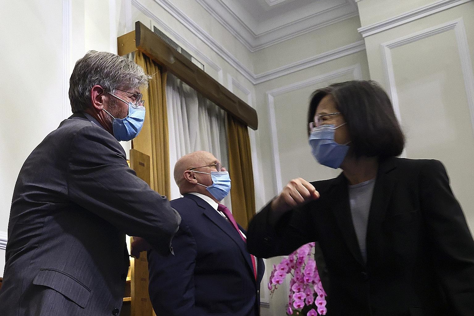Taiwanese President Tsai Ing-wen greeting former US deputy secretary of state James Steinberg, with fellow envoy Richard Armitage (centre), at a meeting in Taipei last week. The two Americans were part of a US delegation visiting Taipei in a trip to 