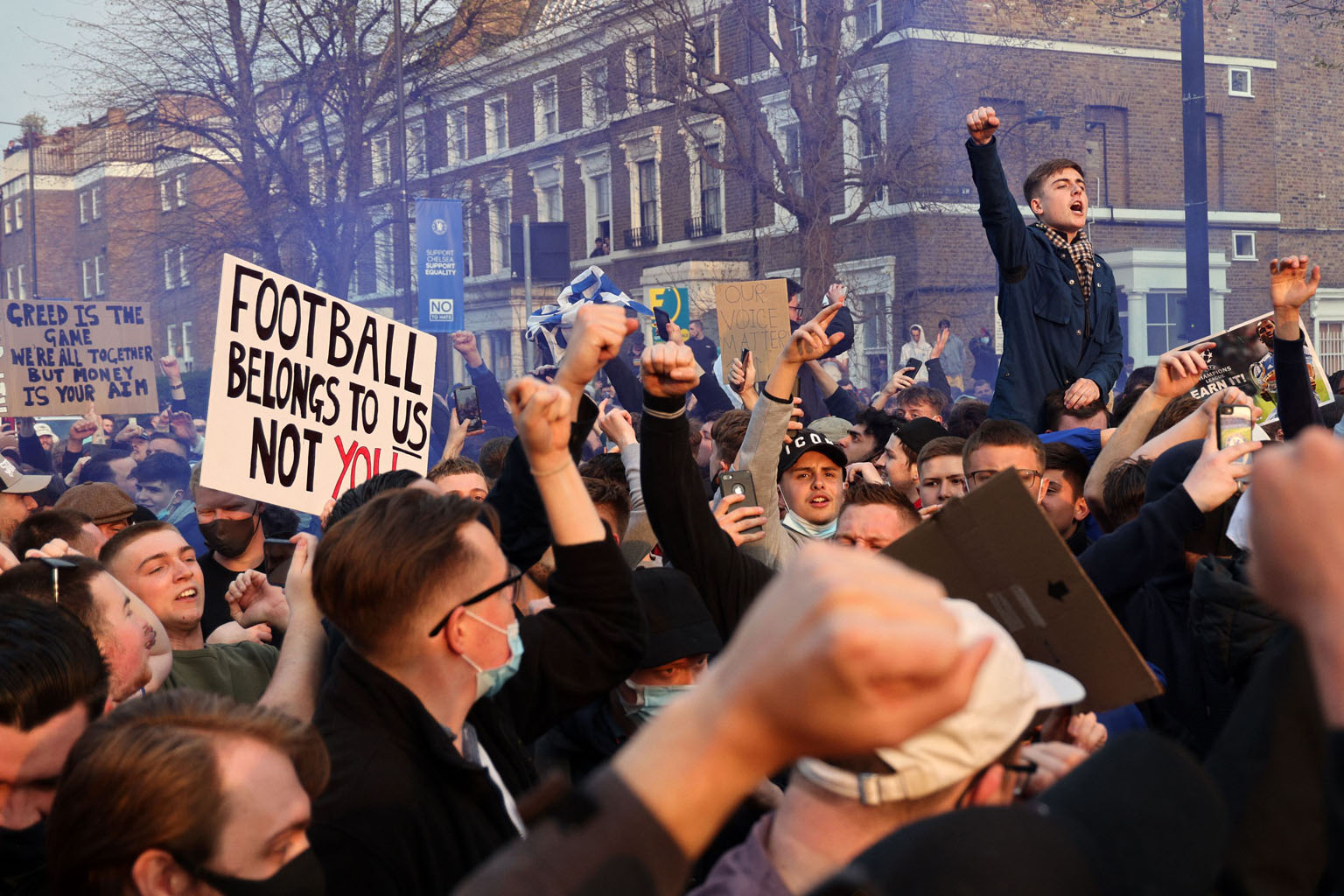 Football supporters demonstrating against the proposed European Super League outside Stamford Bridge on Tuesday, ahead of the English Premier League match between Chelsea and Brighton & Hove Albion.