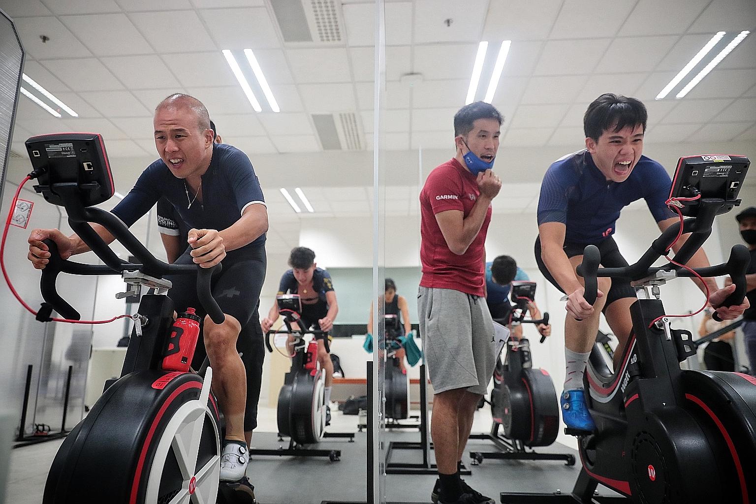 Head coach Adrian Ng observing national cyclist Samuel Leong during the bike test yesterday.
