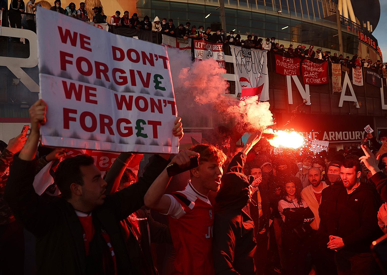 Arsenal fans demonstrating at owner Stan Kroenke's involvement in the failed launch of the Super League outside the Emirates Stadium in London on Friday, when the Gunners lost a seventh home league game this season.