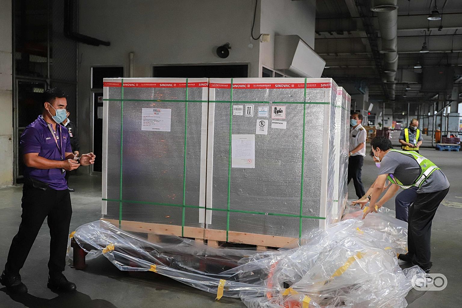 A shipment of China's Sinovac vaccine arriving in Bangkok yesterday. A million more doses are due to arrive in mid-May. PHOTO: AGENCE FRANCE-PRESSE