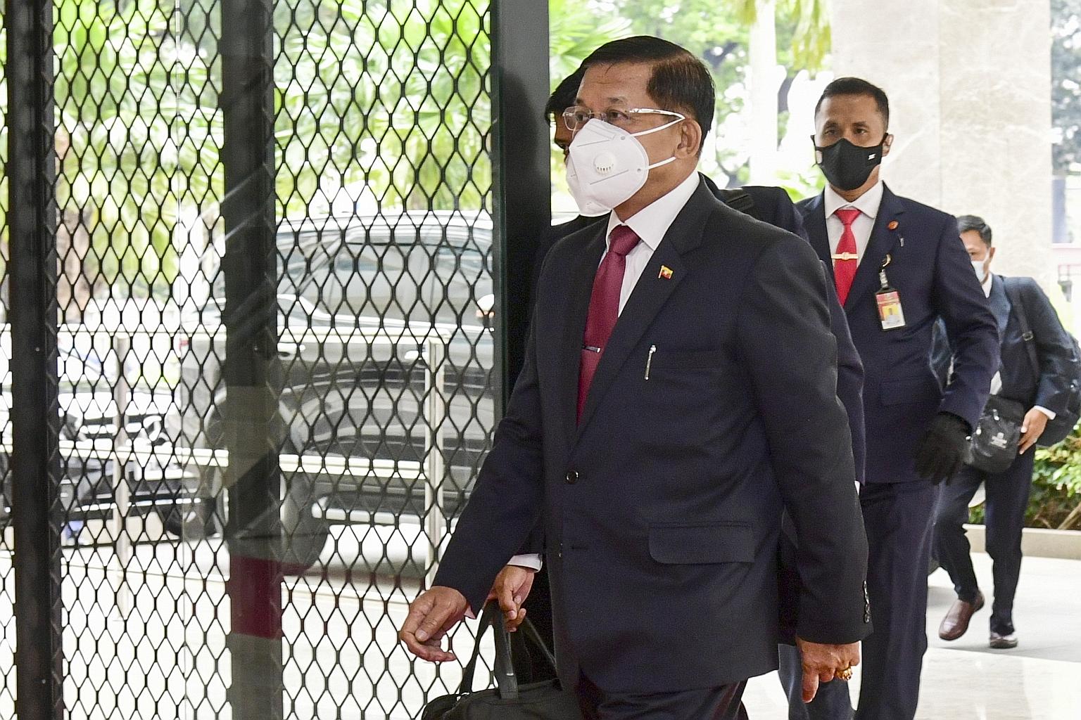 Myanmar junta chief Min Aung Hlaing arriving at the Asean leaders' meeting in Jakarta yesterday, where he justified his Feb 1 coup.