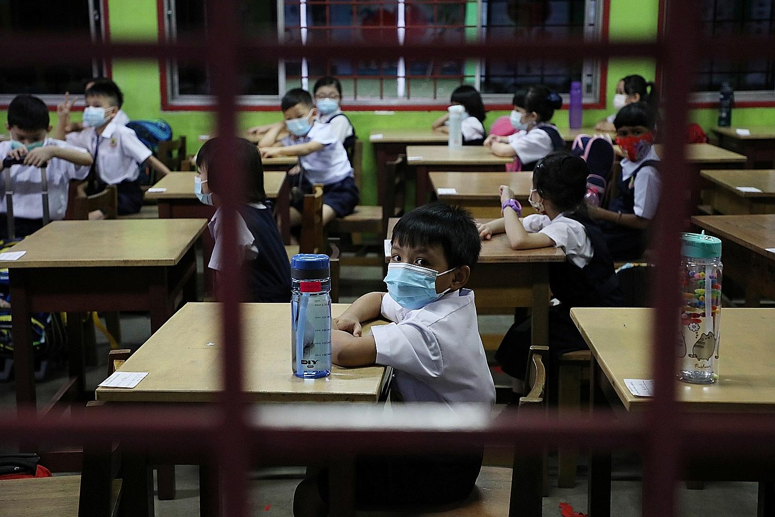 Pupils in a school in Kuala Lumpur. According to Health Minister Adham Baba, 83 Covid-19 clusters involving the education sector have been recorded this year, with 4,868 infections as at last Tuesday. PHOTO: REUTERS