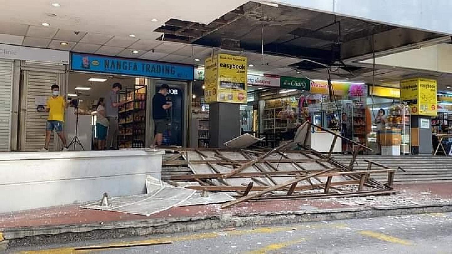 A large section of ceiling boards affixed to a wooden frame, with nails exposed, and other debris were strewn across a section of the steps near the taxi stand at Golden Mile Complex, but no injuries were reported. PHOTO: LIANHE WANBAO READER