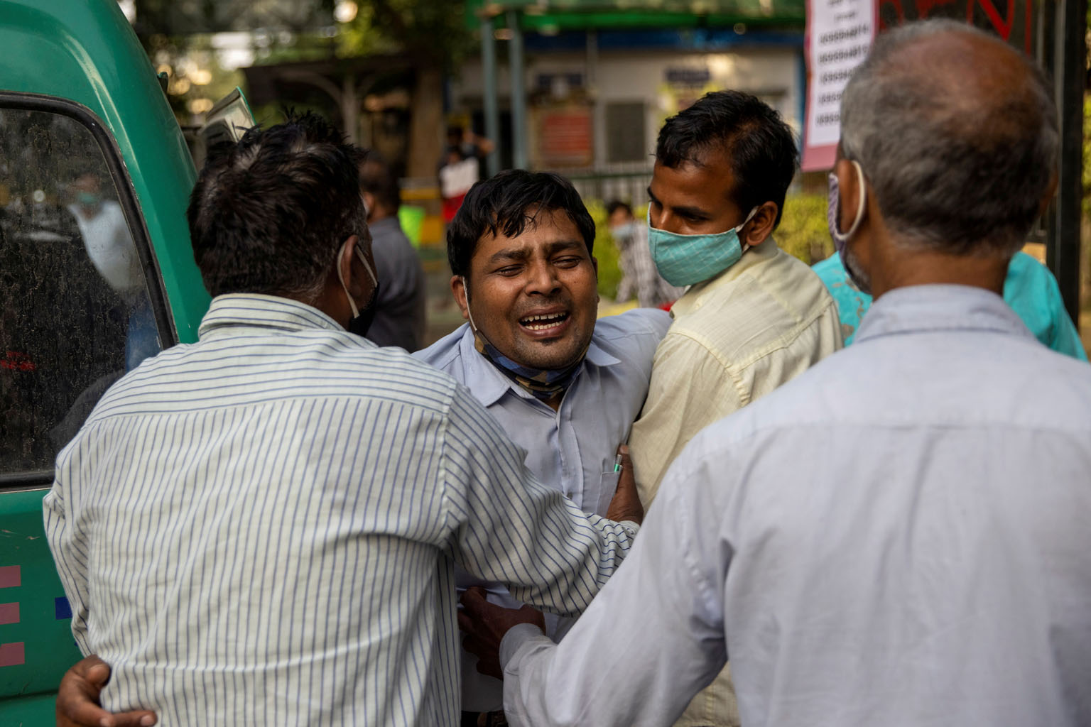 Mr Shayam Narayan's family members mourning after he dies before being admitted to a hospital in New Delhi last Friday.