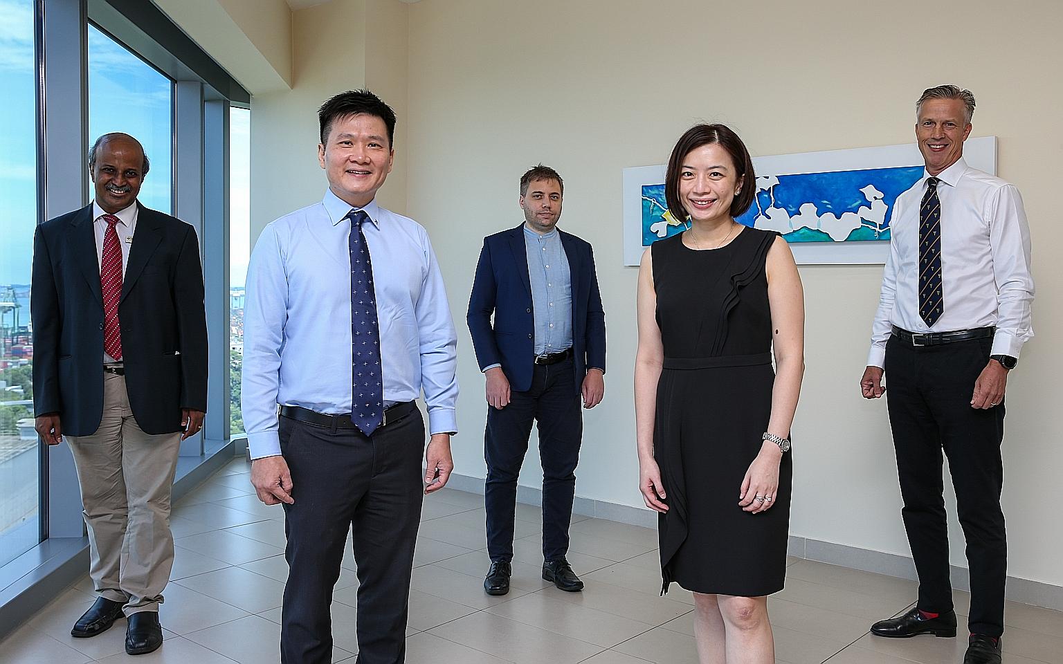 The research team - (from left) Professor Paul Tambyah, Associate Professor Raymond Seet, Associate Professor Alex Cook, Dr Amy Quek and Associate Professor Mikael Hartman - found in their study that taking a povidone-iodine throat spray three times